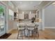 Bright kitchen with a large island, white cabinets, stainless steel appliances, and modern lighting at 1511 N Lake Shore Dr, Sarasota, FL 34231