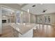 Open-concept kitchen featuring an island with white countertops and modern pendant lighting at 1511 N Lake Shore Dr, Sarasota, FL 34231