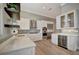 Elegant kitchen featuring stainless appliances, white cabinets, and light countertops at 1511 N Lake Shore Dr, Sarasota, FL 34231