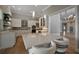 Modern kitchen with stainless steel appliances, white cabinetry, and a center island with barstool seating at 1511 N Lake Shore Dr, Sarasota, FL 34231