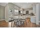 Bright kitchen with a large island, white cabinets, stainless steel appliances, and modern lighting at 1511 N Lake Shore Dr, Sarasota, FL 34231