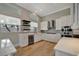 Bright and modern kitchen featuring stainless steel appliances and white cabinetry at 1511 N Lake Shore Dr, Sarasota, FL 34231