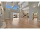 Bright living room with wood floors, high ceilings and view of outdoor seating area at 1511 N Lake Shore Dr, Sarasota, FL 34231