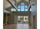 Open-concept living room boasting high ceilings, abundant natural light, and hardwood flooring at 1511 N Lake Shore Dr, Sarasota, FL 34231
