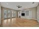 Living room with French doors and built-in shelving at 1511 N Lake Shore Dr, Sarasota, FL 34231