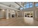 Bright living room with a fireplace, sliding glass doors, and high ceilings allowing ample sunlight at 1511 N Lake Shore Dr, Sarasota, FL 34231