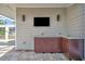 Outdoor kitchen area featuring built-in cabinetry, marble countertops, and paver flooring at 1511 N Lake Shore Dr, Sarasota, FL 34231