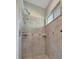 Walk-in shower featuring tiled walls and a shower head at 1511 N Lake Shore Dr, Sarasota, FL 34231