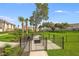 Enclosed dog park with play equipment; a dedicated space for pets to exercise and socialize at 15116 Cuzcorro Ct, Nokomis, FL 34275