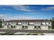 The townhouse style homes have multiple garages and are painted in complementary colors at 15116 Cuzcorro Ct, Nokomis, FL 34275