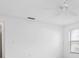 Empty bedroom with a ceiling fan and a window at 1855 Buccaneer Ct, Sarasota, FL 34231