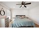 Comfortable bedroom with a modern ceiling fan, dresser, and ample natural light at 1876 Livingstone St, Sarasota, FL 34231