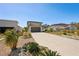 Long driveway leading to a two-story home with well-maintained landscaping and a spacious yard at 1876 Livingstone St, Sarasota, FL 34231