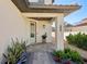 Inviting front entrance with a decorative door, paved walkway, and manicured landscaping at 1876 Livingstone St, Sarasota, FL 34231