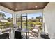 Enclosed lanai featuring comfortable seating and serene outdoor views, perfect for relaxation and entertainment at 1876 Livingstone St, Sarasota, FL 34231
