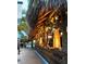 Charming street view of an outdoor bar area featuring thatched roofs and cozy lighting at 1876 Livingstone St, Sarasota, FL 34231