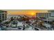 Breathtaking aerial view of the resort, pool, and ocean at sunset at 1930 Harbourside Dr # 136, Longboat Key, FL 34228