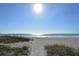 Expansive beach with soft sand and gentle waves, offering a peaceful coastal escape at 1930 Harbourside Dr # 136, Longboat Key, FL 34228
