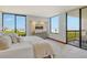 Bedroom with serene waterfront view, creating a peaceful retreat at 1930 Harbourside Dr # 136, Longboat Key, FL 34228