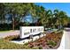South Bay Isles community sign, landscaping, and flowers at 1930 Harbourside Dr # 136, Longboat Key, FL 34228