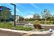 Manicured entrance to the complex with beautiful landscaping and signage at 1930 Harbourside Dr # 136, Longboat Key, FL 34228