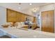Bright kitchen featuring white quartz countertops, stainless appliances, and light wood cabinetry at 1930 Harbourside Dr # 136, Longboat Key, FL 34228