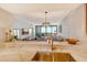 Kitchen sink with a view of the living room and waterfront at 1930 Harbourside Dr # 136, Longboat Key, FL 34228