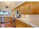 Bright kitchen with white quartz countertops, stainless steel appliances, and hardwood floors at 1930 Harbourside Dr # 136, Longboat Key, FL 34228