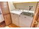 Laundry Room features a Maytag washer and dryer and wood-look floors at 1930 Harbourside Dr # 136, Longboat Key, FL 34228