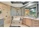 Spa-like bathroom with a luxurious soaking tub, walk-in shower, and dual vanity sinks for added convenience at 2512 61St E Ave, Ellenton, FL 34222