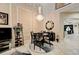 Sophisticated dining space highlighting a striking chandelier, comfortable seating, and seamless flow to the kitchen at 2512 61St E Ave, Ellenton, FL 34222
