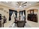 Open dining room with a decorative ceiling fan, large windows, and space for entertaining at 2512 61St E Ave, Ellenton, FL 34222