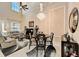 Elegant dining area featuring a chandelier, high ceiling, and seamless transition to the living space at 2512 61St E Ave, Ellenton, FL 34222