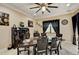 Charming dining room featuring a decorative ceiling fan, seating for six, and natural lighting at 2512 61St E Ave, Ellenton, FL 34222