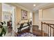Inviting hallway featuring a console table with decorative vases and artwork, leading to other areas of the home at 2512 61St E Ave, Ellenton, FL 34222