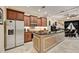 Well-appointed kitchen featuring custom cabinetry, granite countertops, stainless steel appliances, and a large island at 2512 61St E Ave, Ellenton, FL 34222