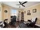 Bright office space with a ceiling fan, black desk chair, and wood floors at 2512 61St E Ave, Ellenton, FL 34222