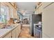 Open kitchen view showcasing modern appliances, ample counter space, and seamless flow to the living area at 2566 Tulip St, Sarasota, FL 34239
