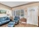 Cozy living room featuring comfortable seating, a window with natural light, and tiled floors at 2566 Tulip St, Sarasota, FL 34239