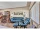 Comfortable living room featuring leather seating, a tall clock, and a bright window at 2566 Tulip St, Sarasota, FL 34239
