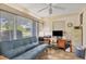 Functional office with a sofa, work desk, filing cabinet, and windows offering natural light at 2566 Tulip St, Sarasota, FL 34239