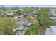 An aerial view shows the backyard pool, lanai and lush landscaping providing a private backyard oasis at 2905 Bougainvillea St, Sarasota, FL 34239