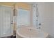 Bathroom features a soaking tub with shower, and plenty of natural light at 2905 Bougainvillea St, Sarasota, FL 34239