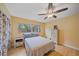 Bedroom featuring light hardwood floors, yellow walls, and a calming atmosphere at 2905 Bougainvillea St, Sarasota, FL 34239