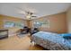 Bedroom features wood floors, natural light, and an adjacent office setup at 2905 Bougainvillea St, Sarasota, FL 34239