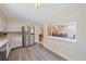 Bright kitchen with stainless steel appliances, white cabinetry, and open layout to the dining area at 2905 Bougainvillea St, Sarasota, FL 34239