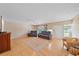 Bright living room featuring hardwood floors, comfortable couches, and a large window at 2905 Bougainvillea St, Sarasota, FL 34239