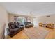 Bright living room featuring hardwood floors, comfortable couches, and a large window at 2905 Bougainvillea St, Sarasota, FL 34239