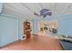 Spacious living room featuring brick floors, a unique ceiling fan, and an open layout at 2905 Bougainvillea St, Sarasota, FL 34239