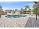 Inviting backyard pool with screened-in lanai and wood deck area, perfect for relaxation and outdoor entertainment at 2905 Bougainvillea St, Sarasota, FL 34239